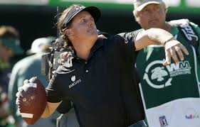 Phil Mickelson throwing a football